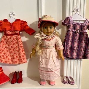 American girl doll- Caroline Abbot (retired) plus 2 full outfits- used